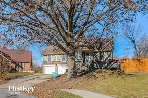 Independence house for rent - a house with a large tree in front of it