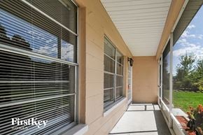 Winter Haven house for rent - a covered walkway leads to the front door of a house