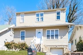 Independence house for rent - a white house with a white door and white stairs
