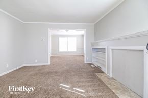Independence house for rent - a bedroom with a carpeted floor and a closet with white walls and a window