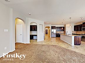Argyle house for rent - the kitchen and living room of a house with a large rug
