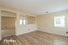 San Tan Valley house for rent - the spacious living room with wood flooring and white walls