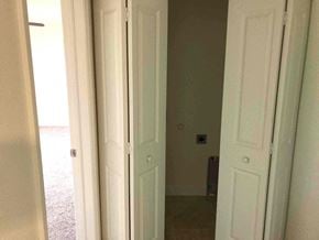 Cape Coral house for rent - a view from the closet into the living room with the door open