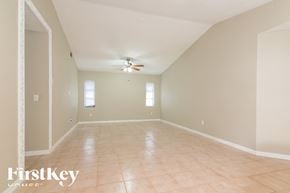 Port Charlotte house for rent - a empty living room with a ceiling fan