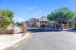 Phoenix house for rent - A gated community with houses and a clear blue sky.