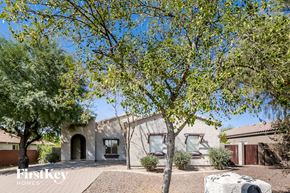 Phoenix house for rent - A house with a tree in front of it.