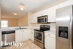 Miami house for rent - A kitchen with a FirstKey Homes logo.