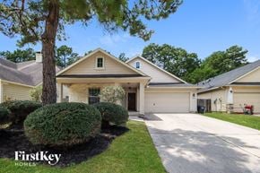 Humble house for rent - A house with a tree in front of it and a sign that says "FirstKey Homes".