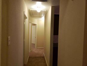 Princeton house for rent - a hallway with a hallway light and a door to a bedroom