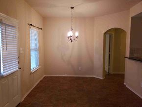 Princeton house for rent - an empty dining room with a chandelier and window