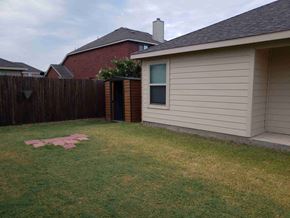 Princeton house for rent - a backyard with a house and a yard with grass