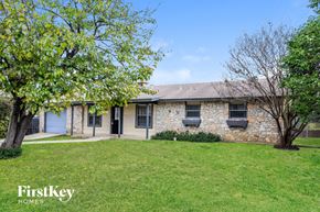 San Antonio house for rent - A stone house with a tree in front of it.