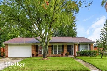 Orange Park house for rent - a home with a large tree in the front yard
