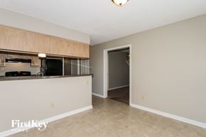 Memphis house for rent - A kitchen area with a counter and a fridge.