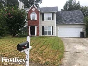 Lawrenceville house for rent - A brick house with a mailbox in front of it.