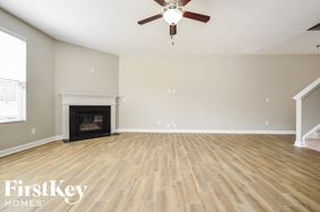 Mcdonough house for rent - the living room has a fireplace and hardwood floors