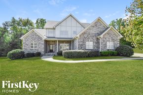 Bessemer house for rent - A house with a lawn in front of it and the words "FirstKey Homes" on the bottom.