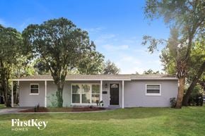 Winter Park house for rent - a white house with a lawn and trees