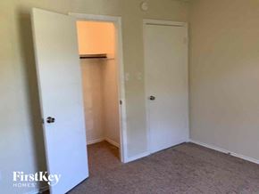 Lewisville house for rent - a bedroom with a closet and a door to a closet