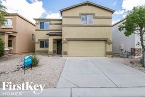 San Tan Valley house for rent - an empty driveway in front of a tan house