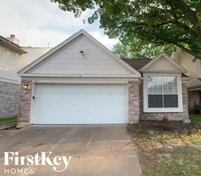 Katy house for rent - A house with a garage door and a window is for sale.