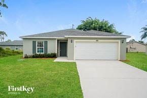 Port St. Lucie house for rent - A house with a garage and a driveway in front of it.