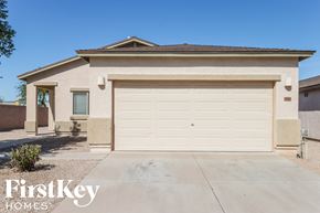 San Tan Valley house for rent - a home with a white garage door in front of it