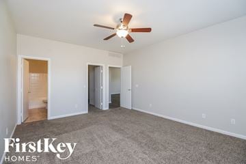 San Tan Valley house for rent - a living room with carpet and a ceiling fan