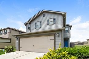 Houston house for rent - a gray house with a white garage door