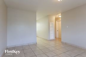 North Lauderdale house for rent - an empty living room with white walls and a tiled floor