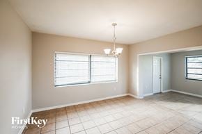 Cutler Bay house for rent - a dining room with a large window and a tiled floor