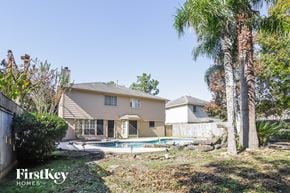 Katy house for rent - A house with a pool in the backyard.