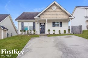 Kannapolis house for rent - the front of a white house with a driveway