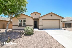 San Tan Valley house for rent - a beige house with a driveway and a tree