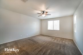 San Tan Valley house for rent - a living room with a ceiling fan and a window