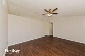 North Port house for rent - a living room with hardwood flooring and a ceiling fan