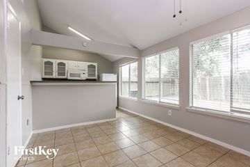 Katy house for rent - A kitchen area with a countertop and cabinets.