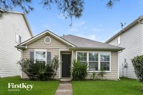 Houston house for rent - A house with a FirstKey Homes sign in front of it.