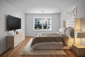 Paterson apartment for rent - a bedroom with a bed and a tv