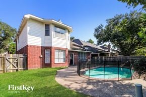 Katy house for rent - a backyard with a pool and a house