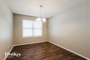 Houston house for rent - the spacious dining room with wood flooring and a window