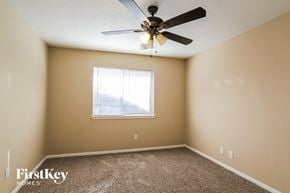 Humble house for rent - a bedroom with a ceiling fan and a window