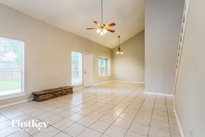 Humble house for rent - A spacious room with a ceiling fan and tile flooring.