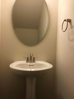 Davidson house for rent - a small bathroom with a sink and a mirror