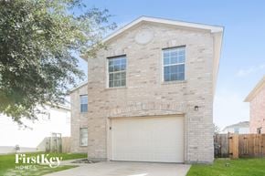 Cypress house for rent - a white brick house with a white garage door