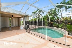 Cape Coral house for rent - a pool in a glass enclosure in a house with a pool