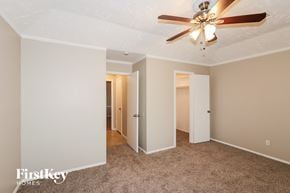 Humble house for rent - a bedroom with a ceiling fan and a closet