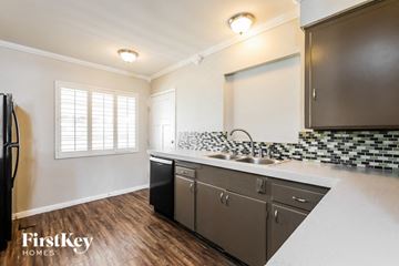 Phoenix house for rent - a kitchen with a sink and a window