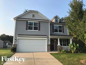 Charlotte house for rent - a gray house with a white garage door