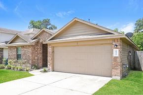 Spring house for rent - A house with a garage door that has a number 1 on it.